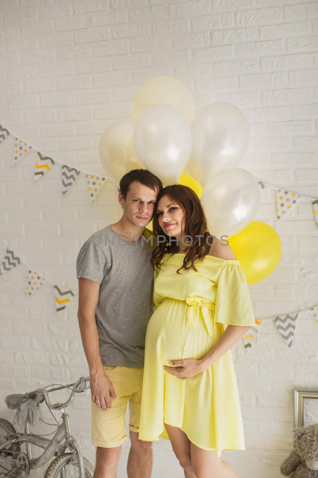 Young attractive couple: pregnant mother and happy father. by StudioPeace