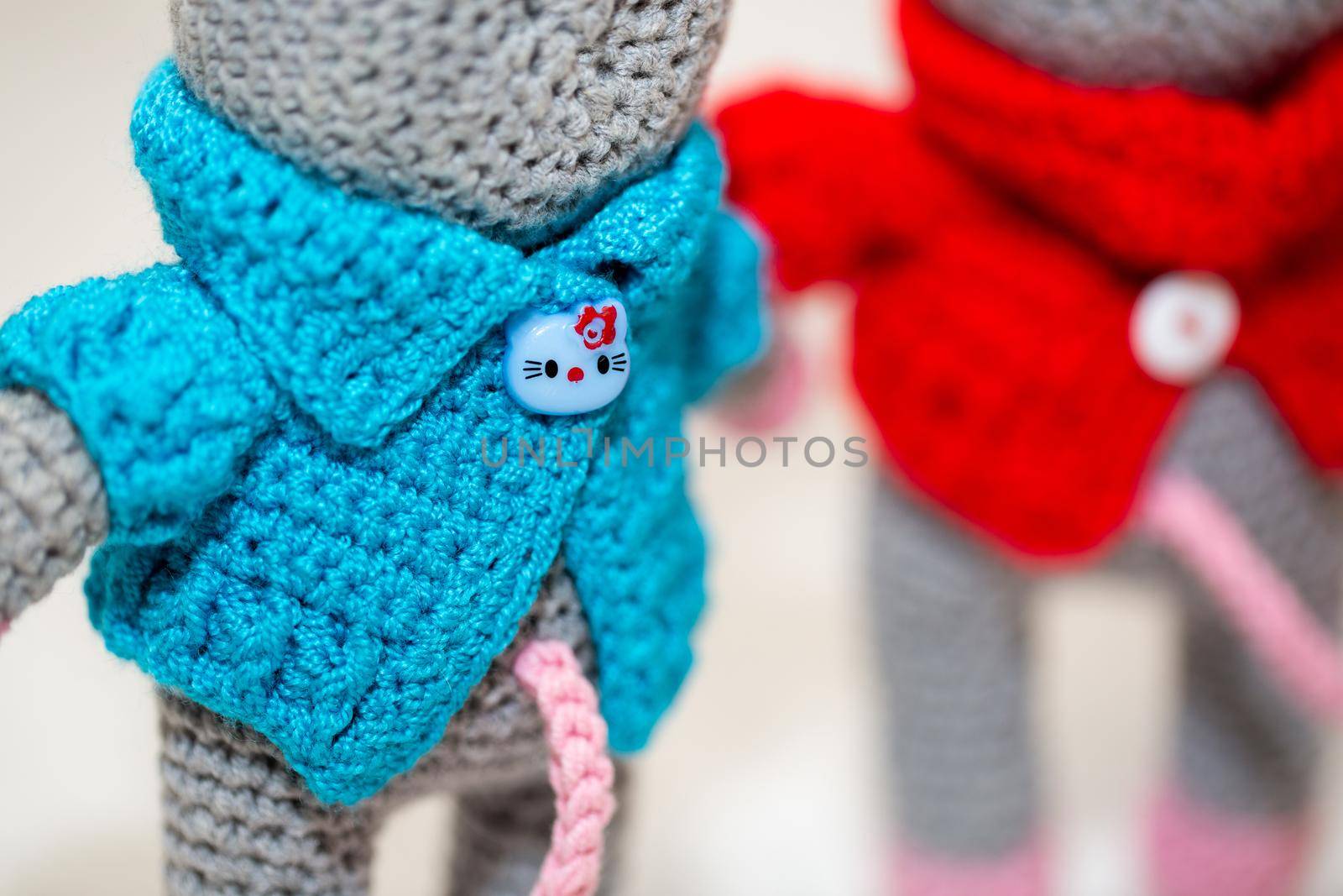 A knitted mouse. A soft toy as a symbol of the New Year.