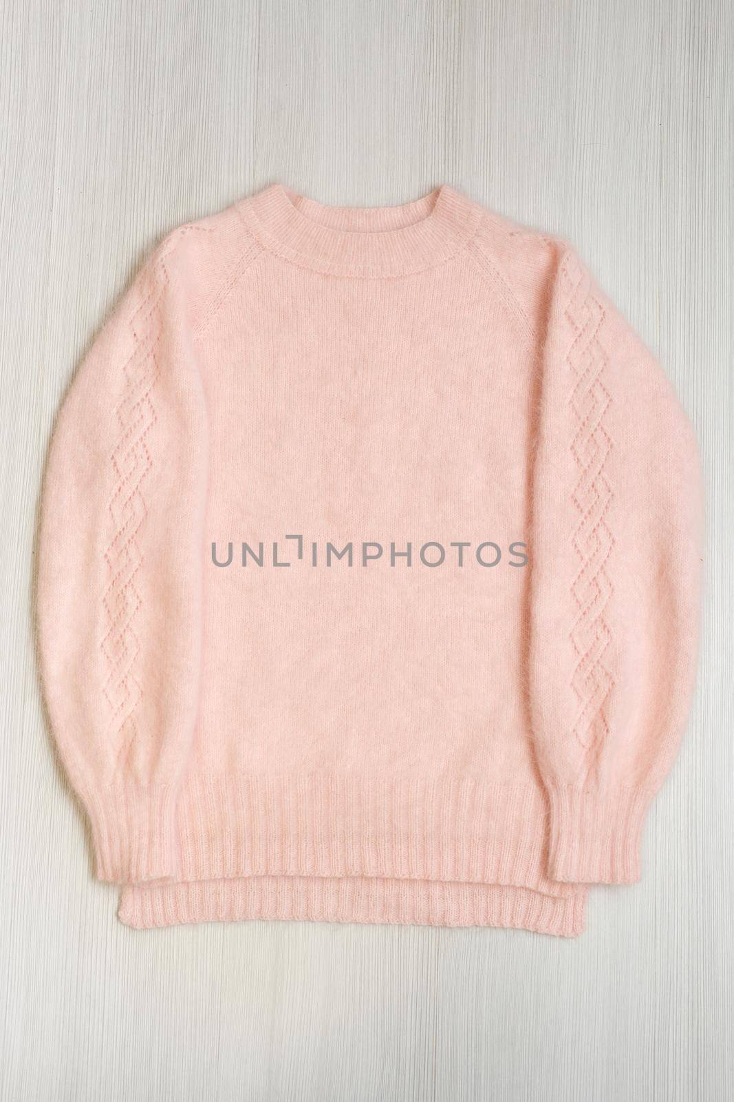 Knitted women's sweater on a white background