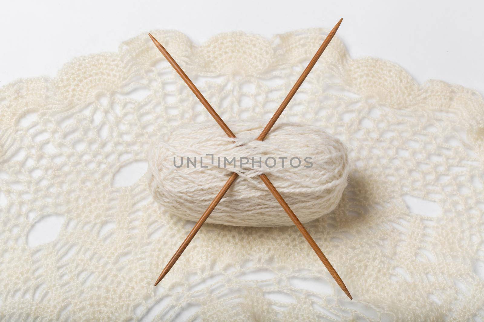 Ball of yarn and knitting