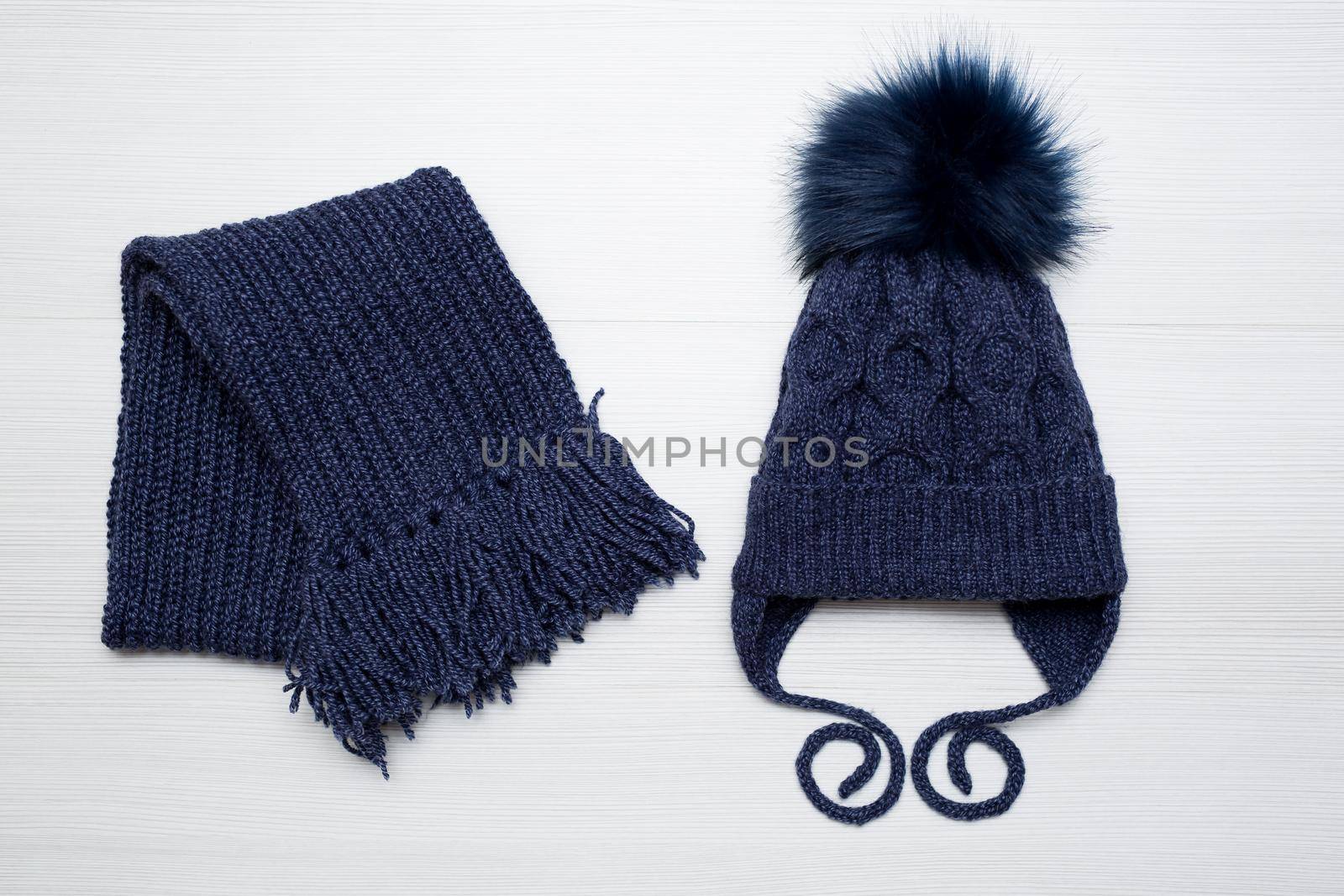 Winter children's knitted hat and scarf in blue