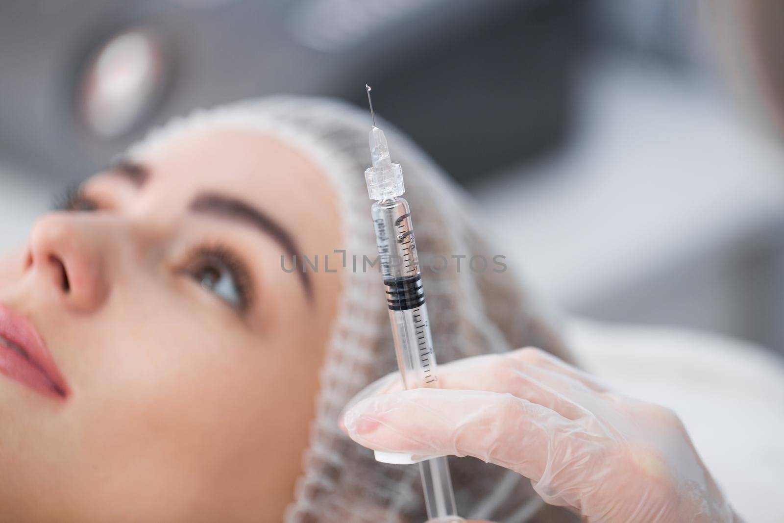 Syringe with filler for face contouring or augmentation. Model, point of view. Cosmetological clinic. Healthcare, cosmetology, clinic