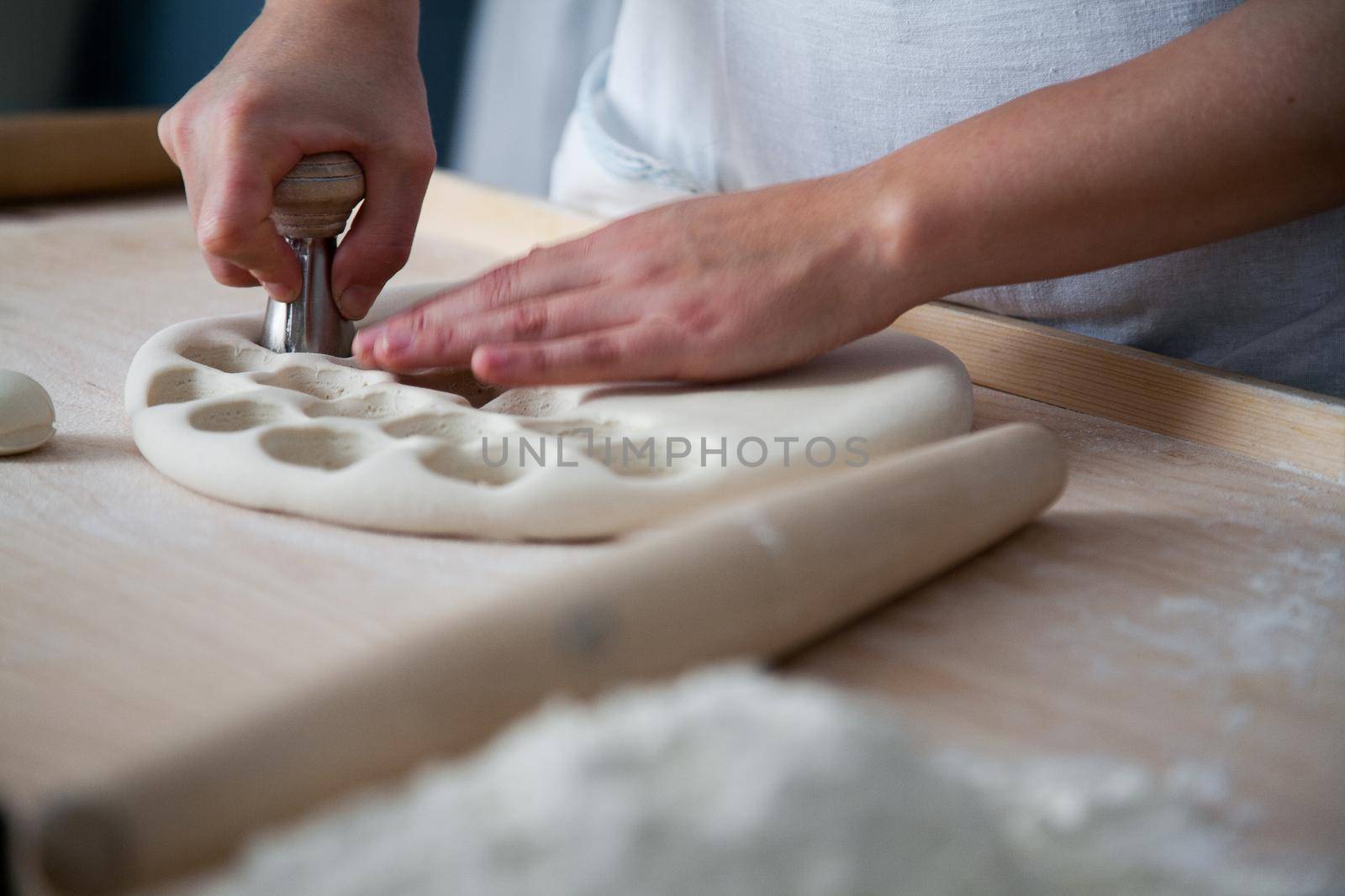 The cook is preparing Prosphora. Liturgical bread. The sacrament of communion by StudioPeace