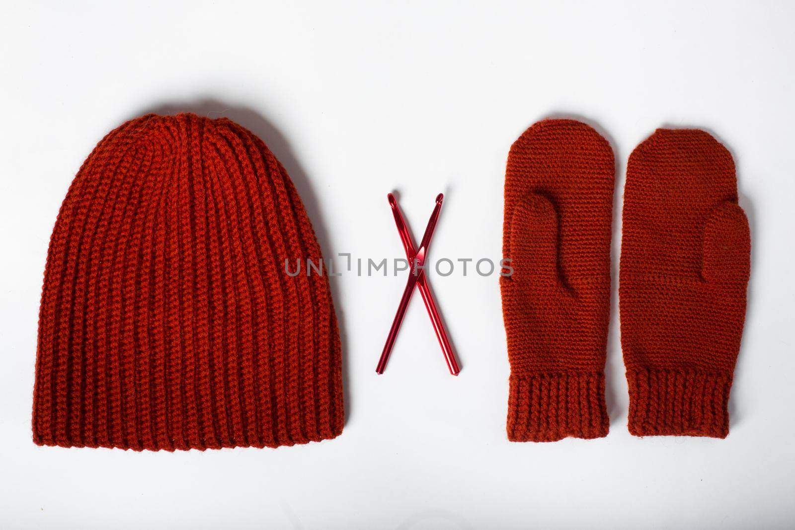 knitted hat with gloves red on a white background by StudioPeace