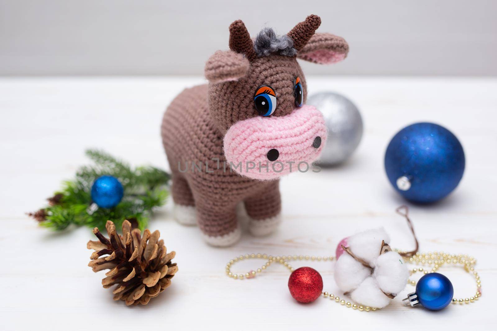 A knitted bull. A soft toy as a symbol of the New Year.