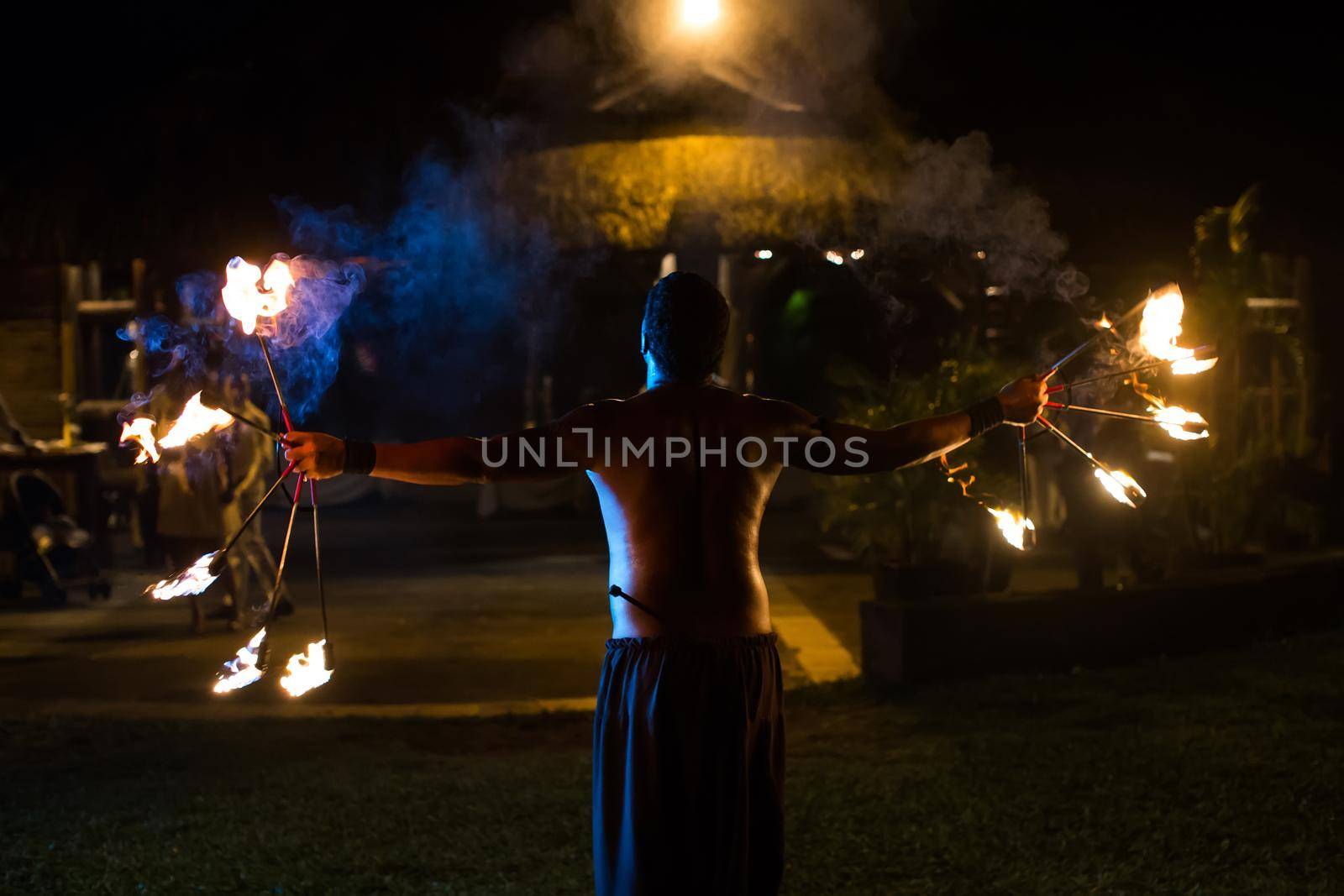 Fire starter performing an amazing fire show. by StudioPeace