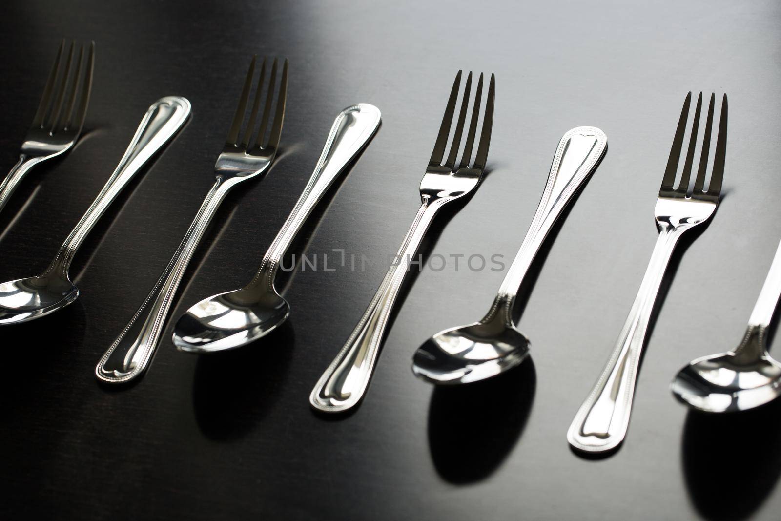 Cutlery on a black background. Fork, spoon, knife by StudioPeace