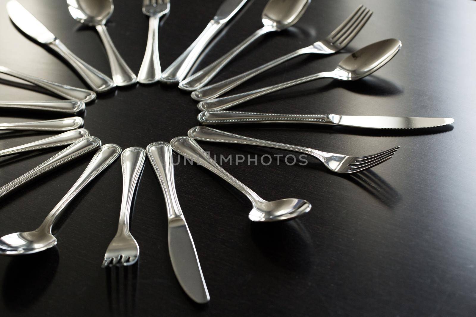 Cutlery on a black background. Fork, spoon knife