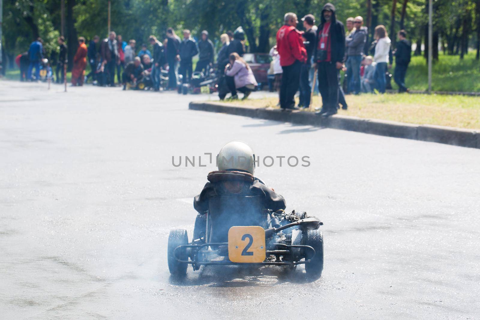 Karting - driver in helmet on kart circuit