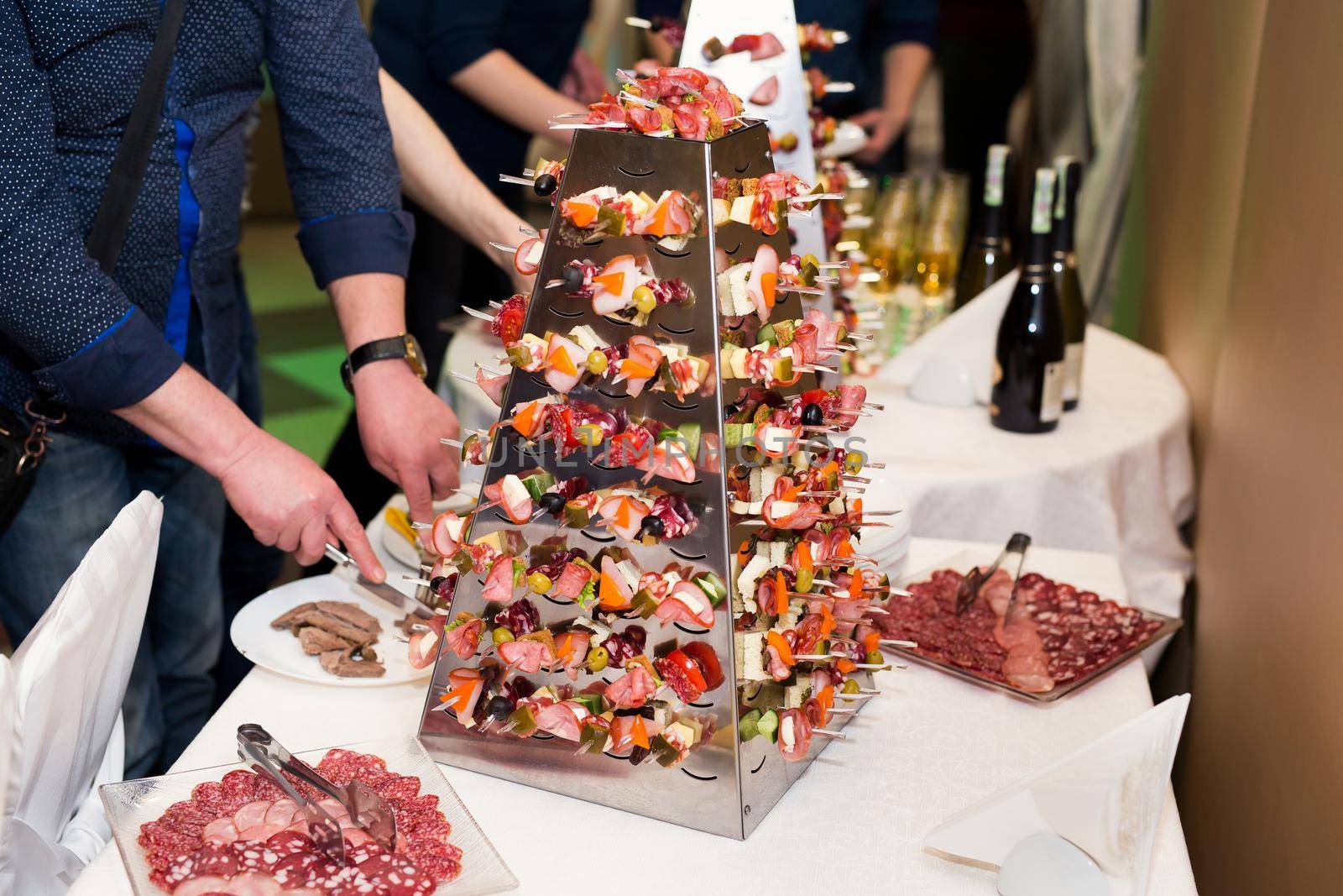 Catering. Off-site food. Buffet table with various canapes and snacks by StudioPeace