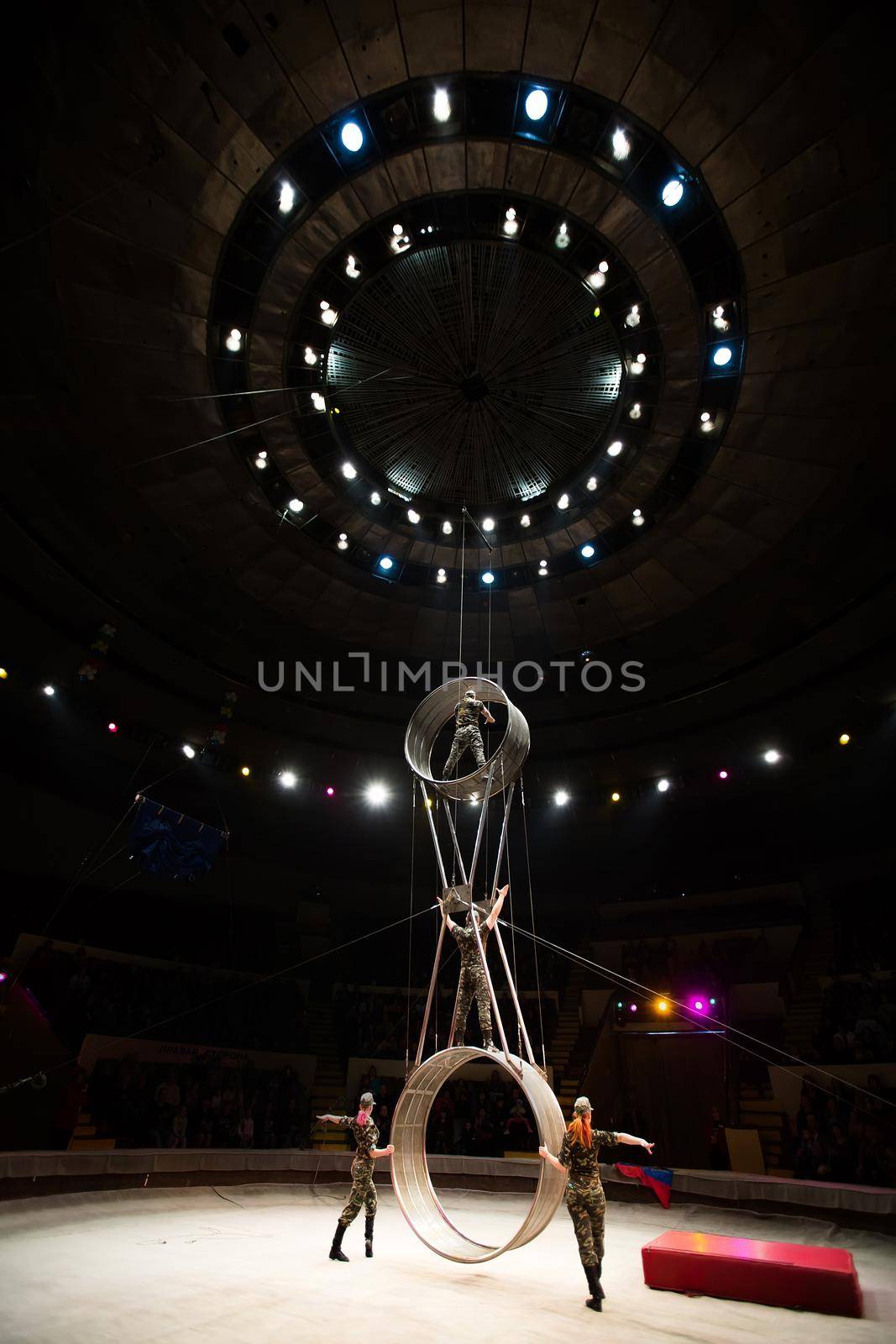 acrobats in the circus perform a complex trick