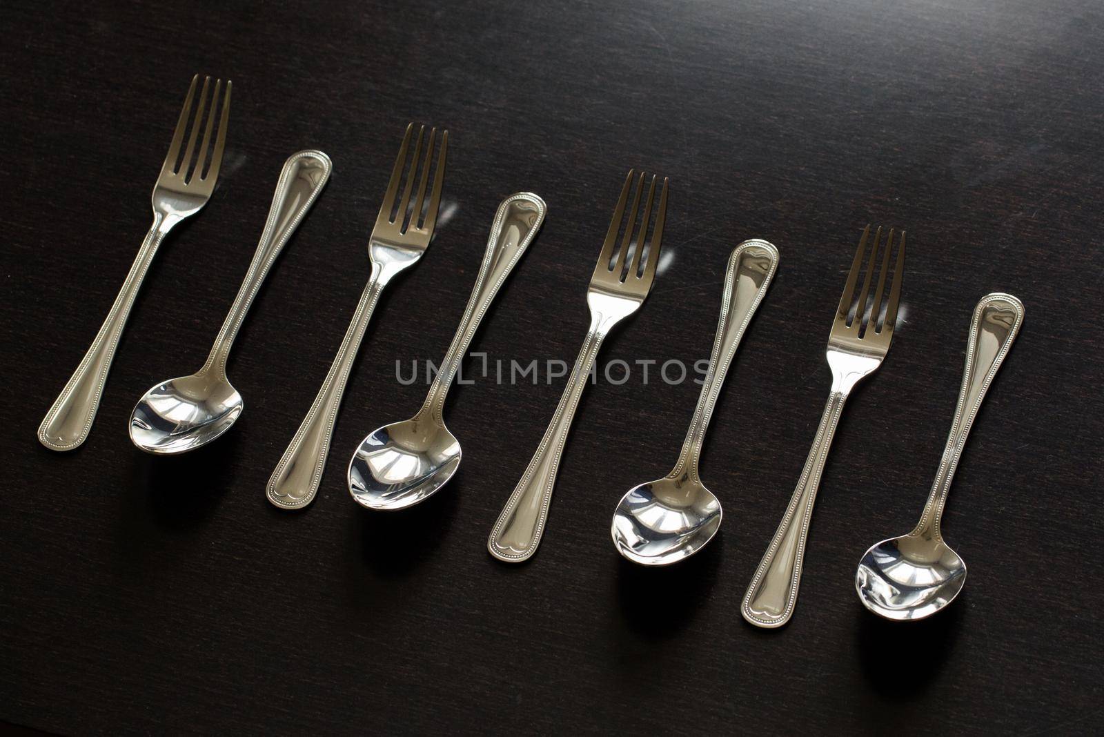 Cutlery on a black background. Fork, spoon knife