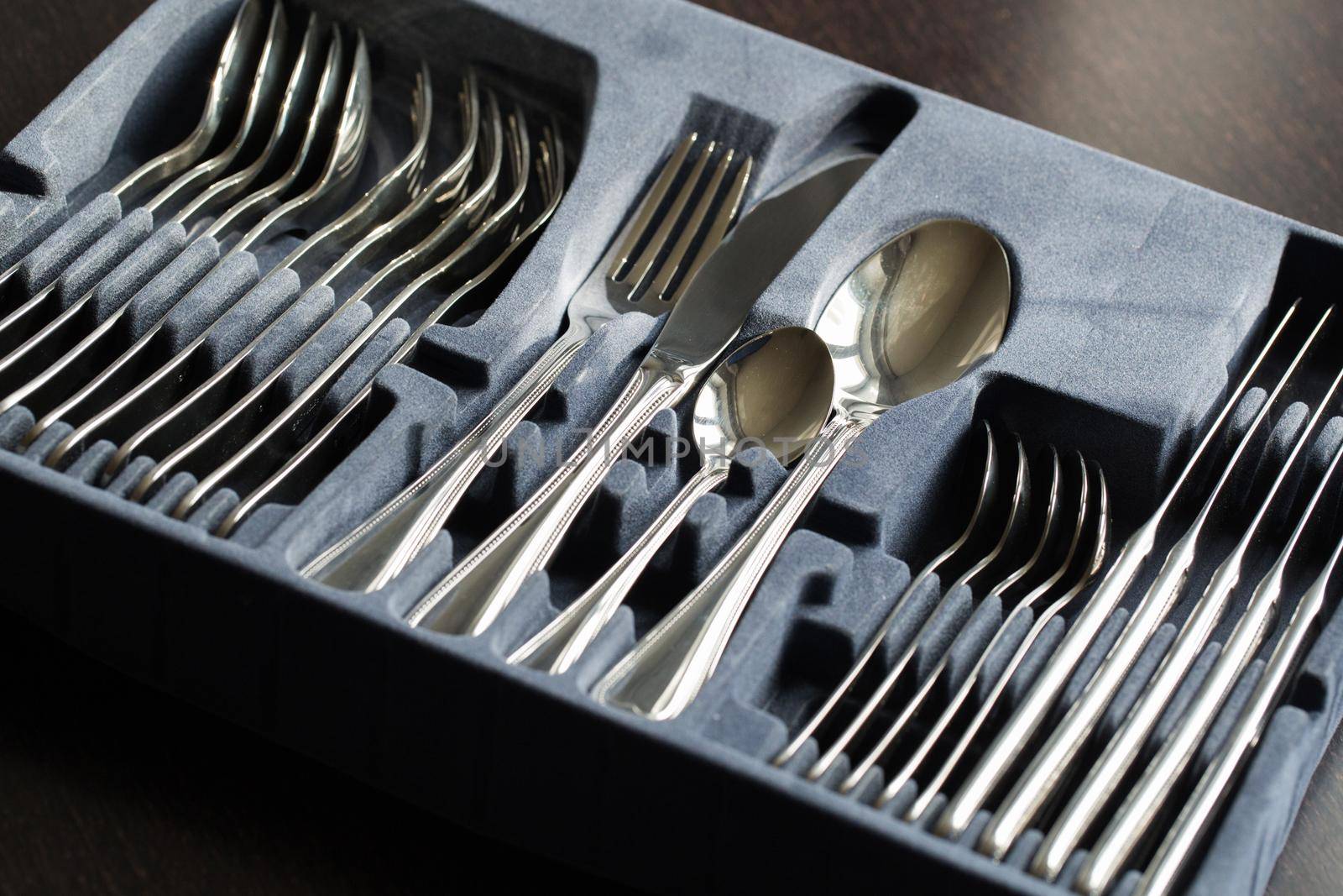 Blue flatware box isolated on black background