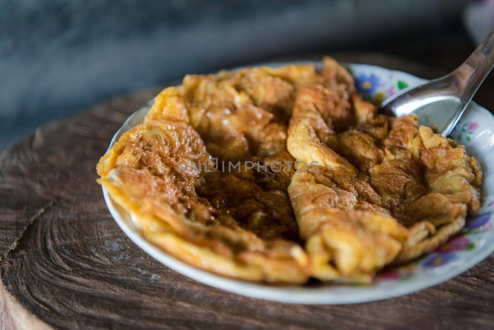 Thai style omelet in Thai street food restaurant by NongEngEng