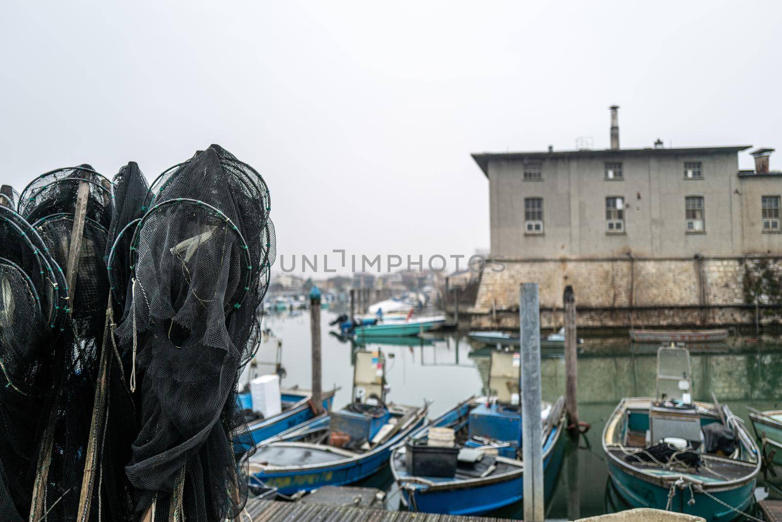 Some small fishing boats in an old fishing port.