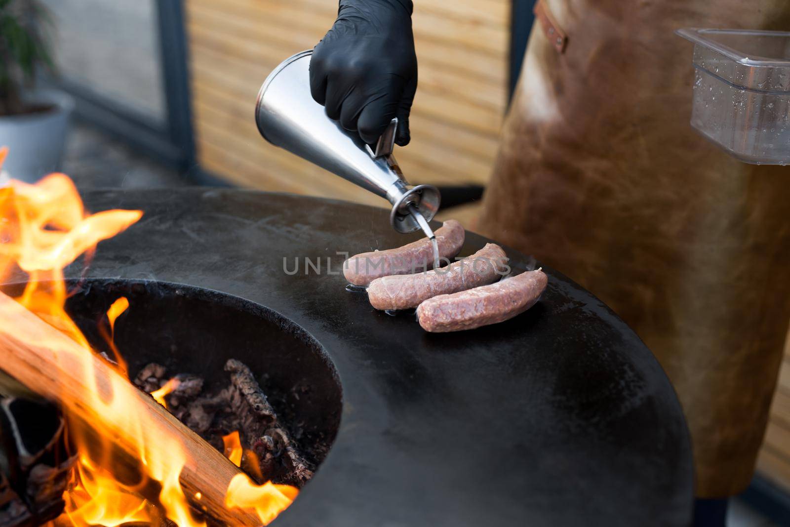 Sausage on Barbeque Smoker Grill. Hot and smoked sausage. Food Festival