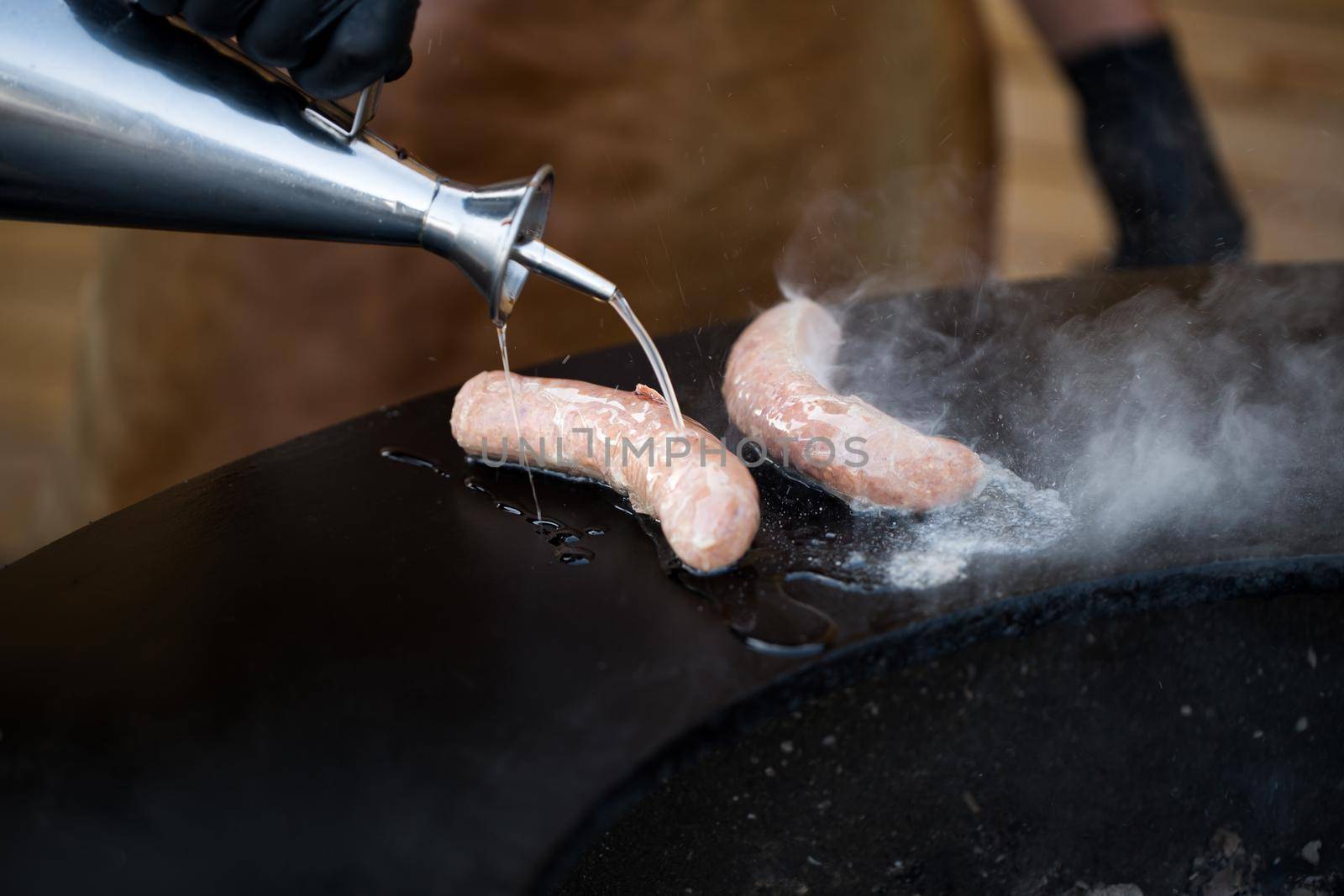 Sausage on Barbeque Smoker Grill. Hot and smoked sausage. Food Festival. by StudioPeace