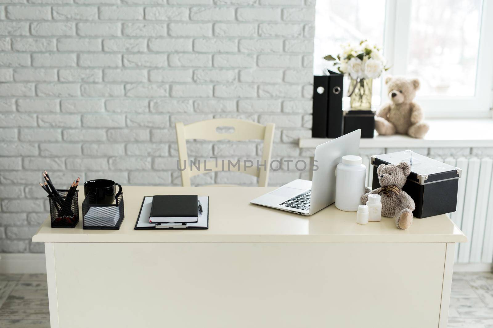 Workplace of a pediatric doctor in the clinic. by StudioPeace