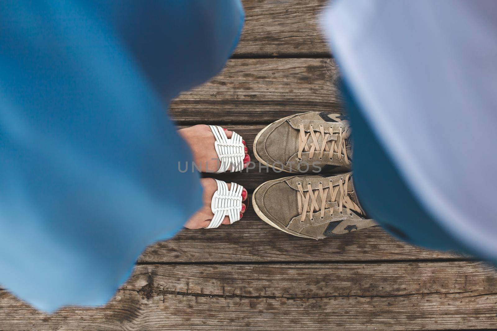 Closeup portrait of a Male and female legs during a date