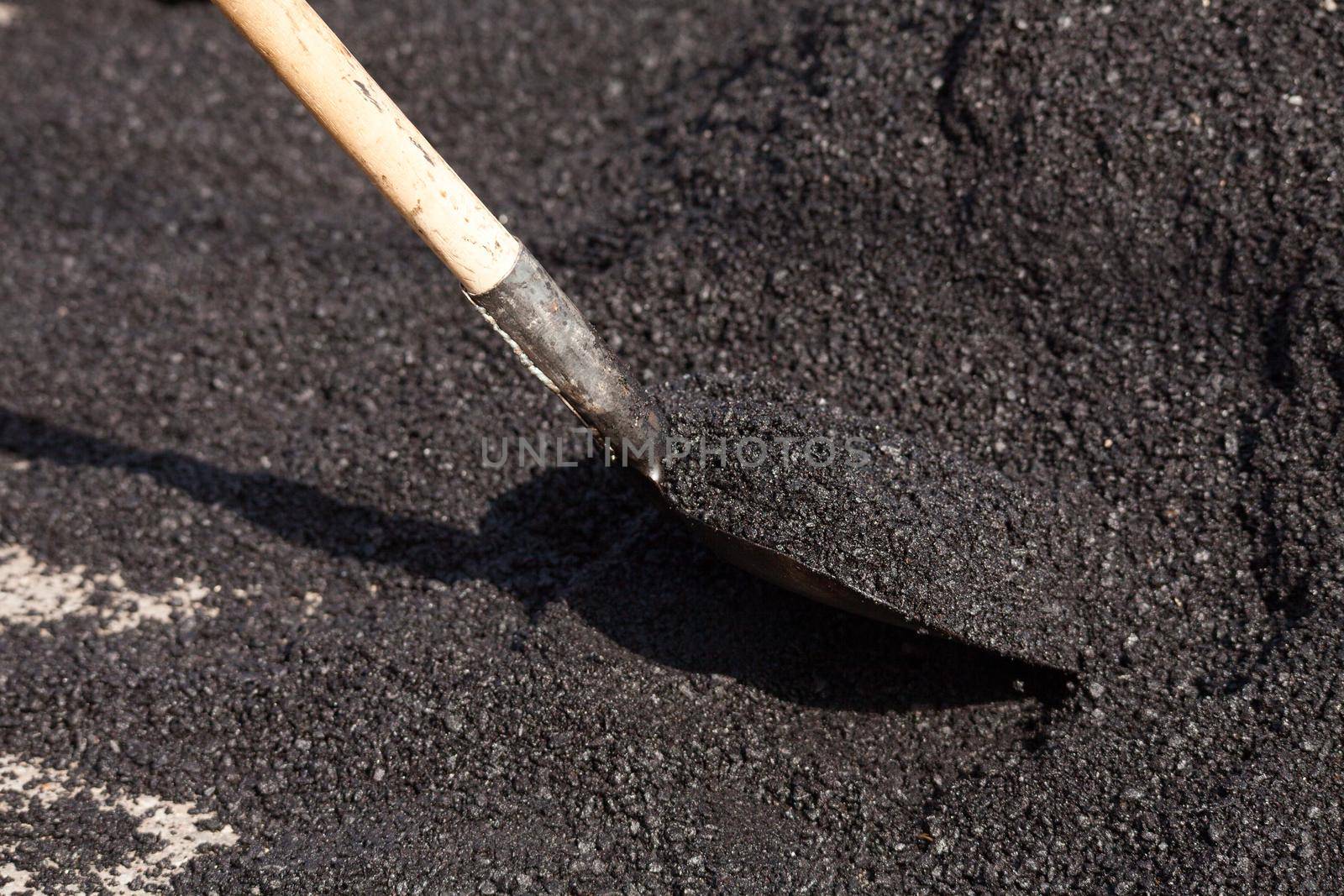 Repair of roads on the street, asphalt close-up