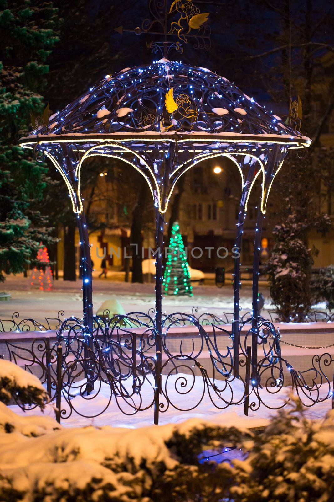 Christmas tree on the main Square on a winter night in snow
