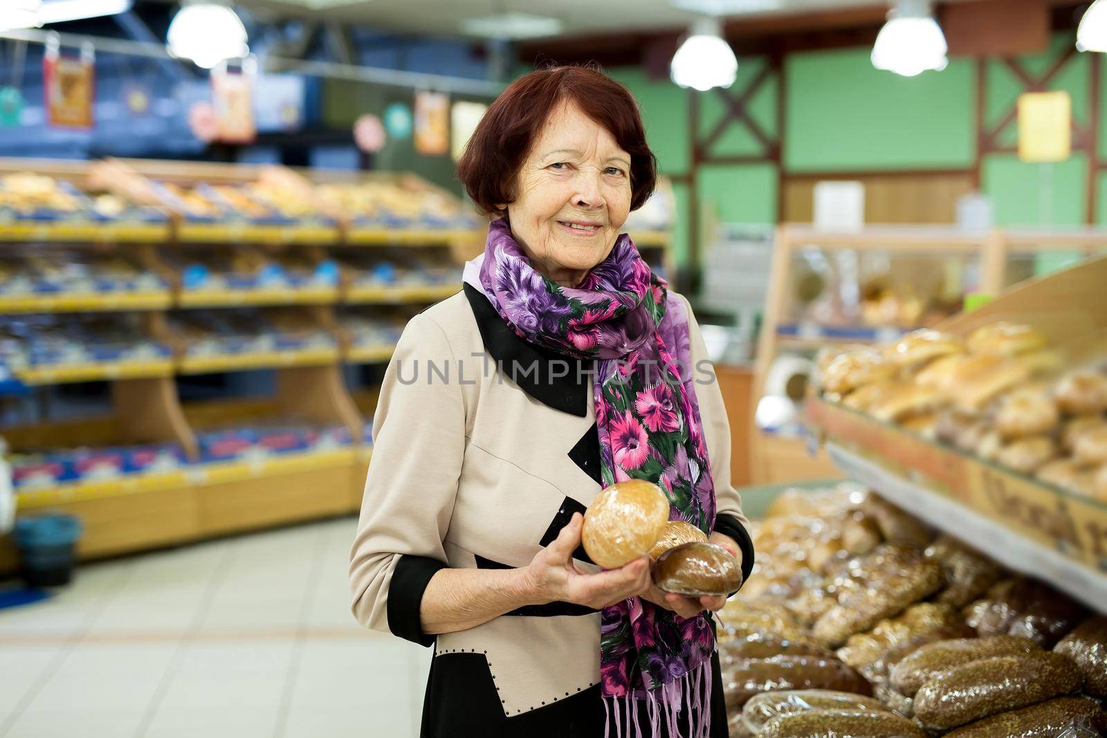 Woman during shopping bread and baguette at supermarket store shop. by StudioPeace