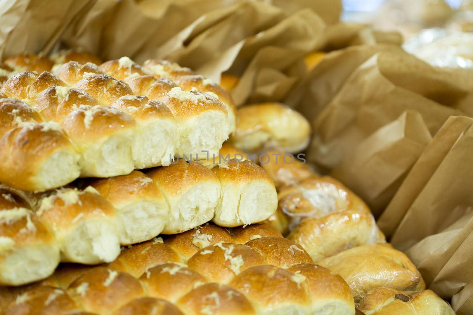 Pampushka. Traditional ukrainian buns with garlic. Bread background. by StudioPeace