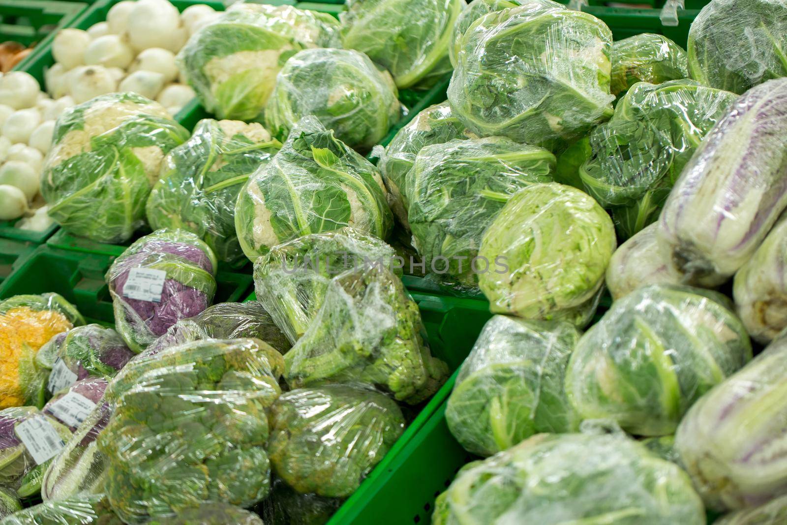 Cabbage for sale in a supermarket window. by StudioPeace