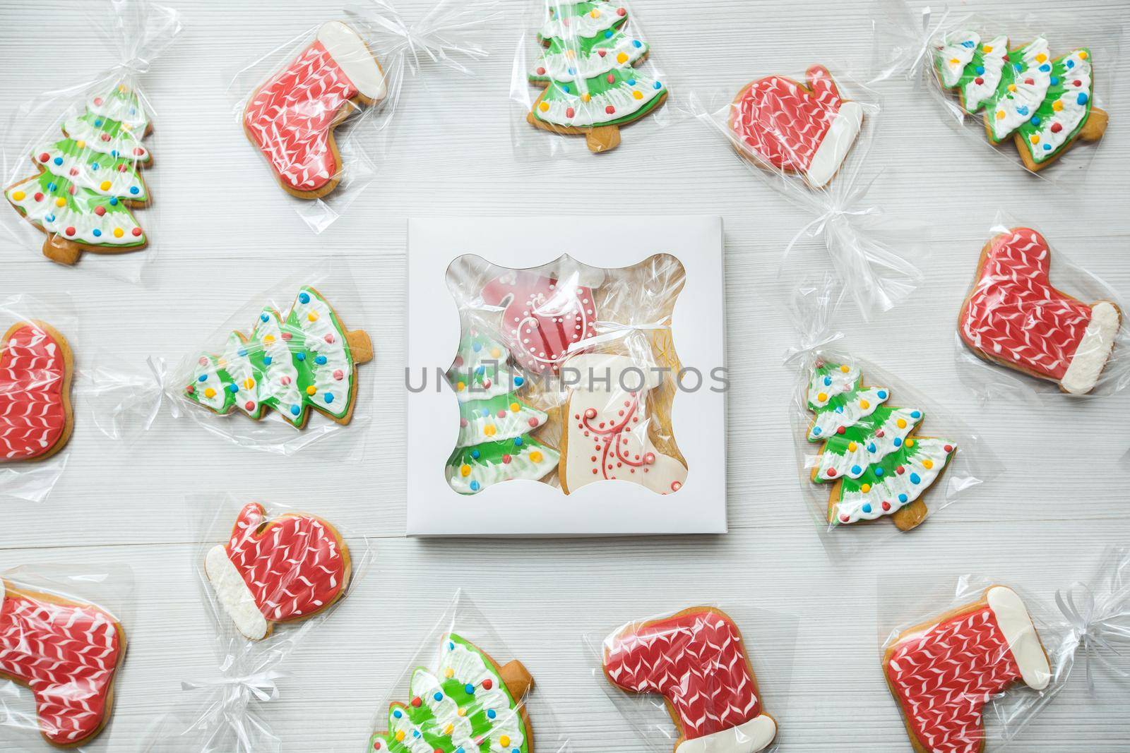 A box with Christmas gingerbread on a wooden background.