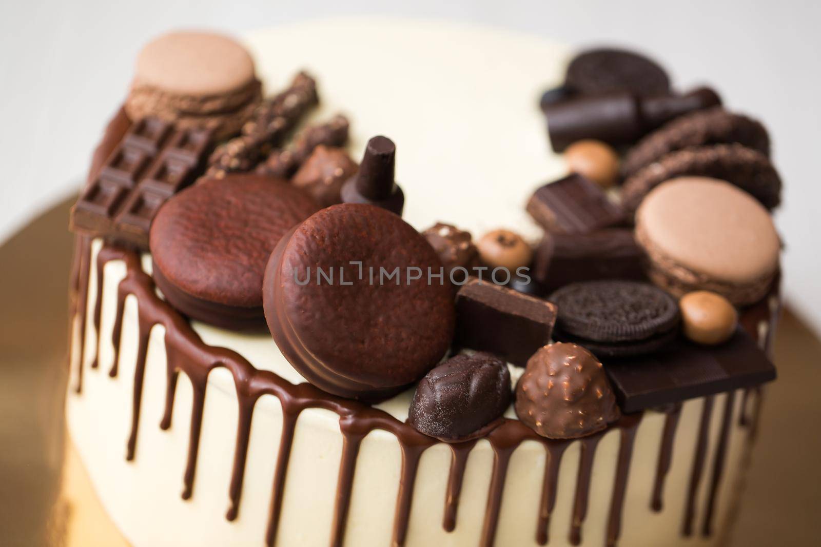 Chocolate cake for men with chocolate decorations and the streaks of chocolate. by StudioPeace