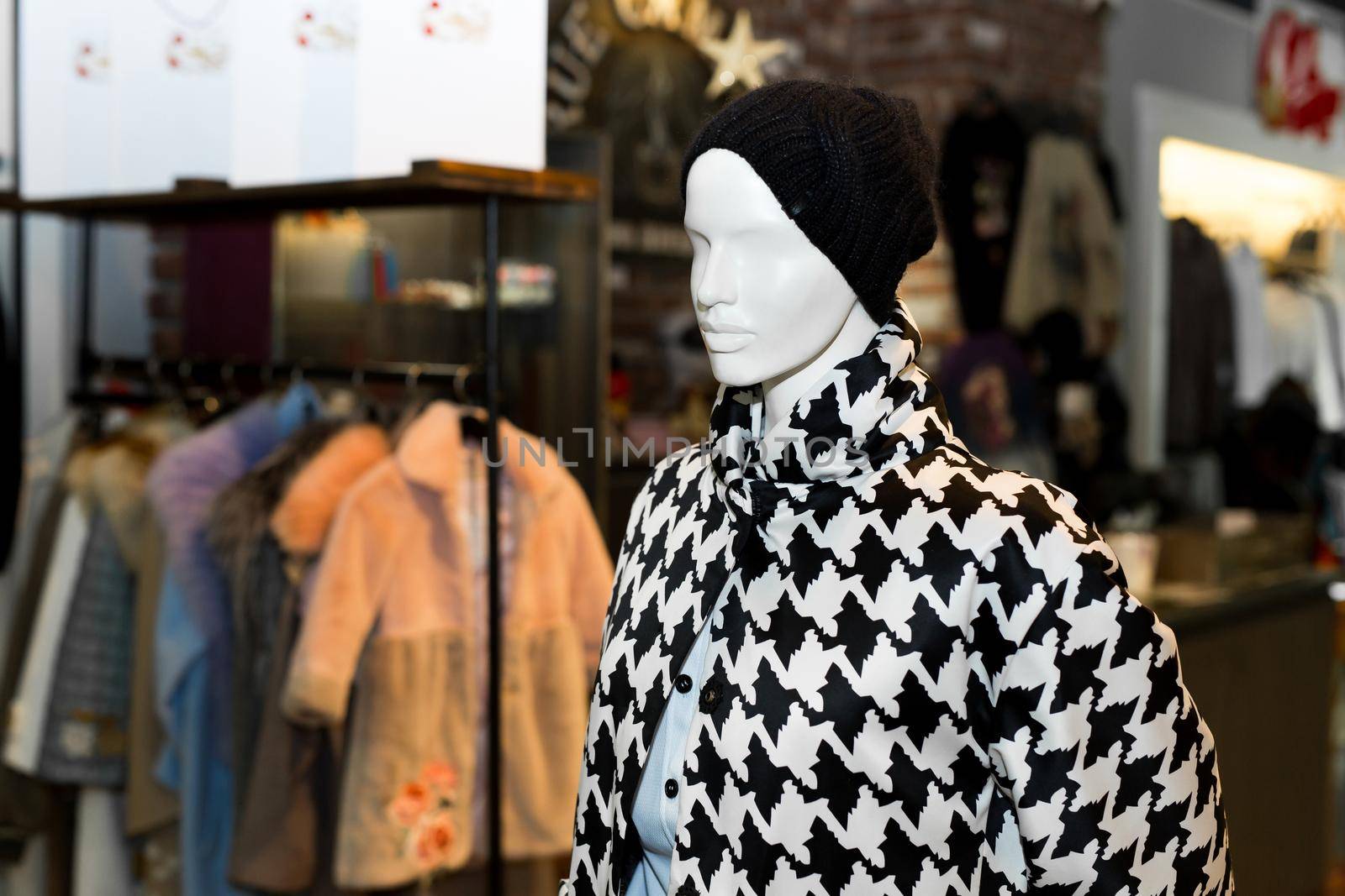 Women's coat on mannequin. Autumn coat. Individual tailoring