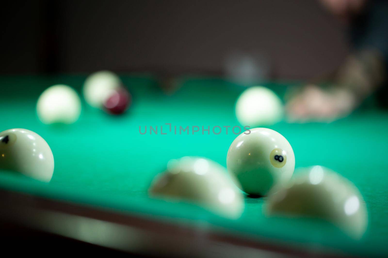 Billiard balls in a green pool table