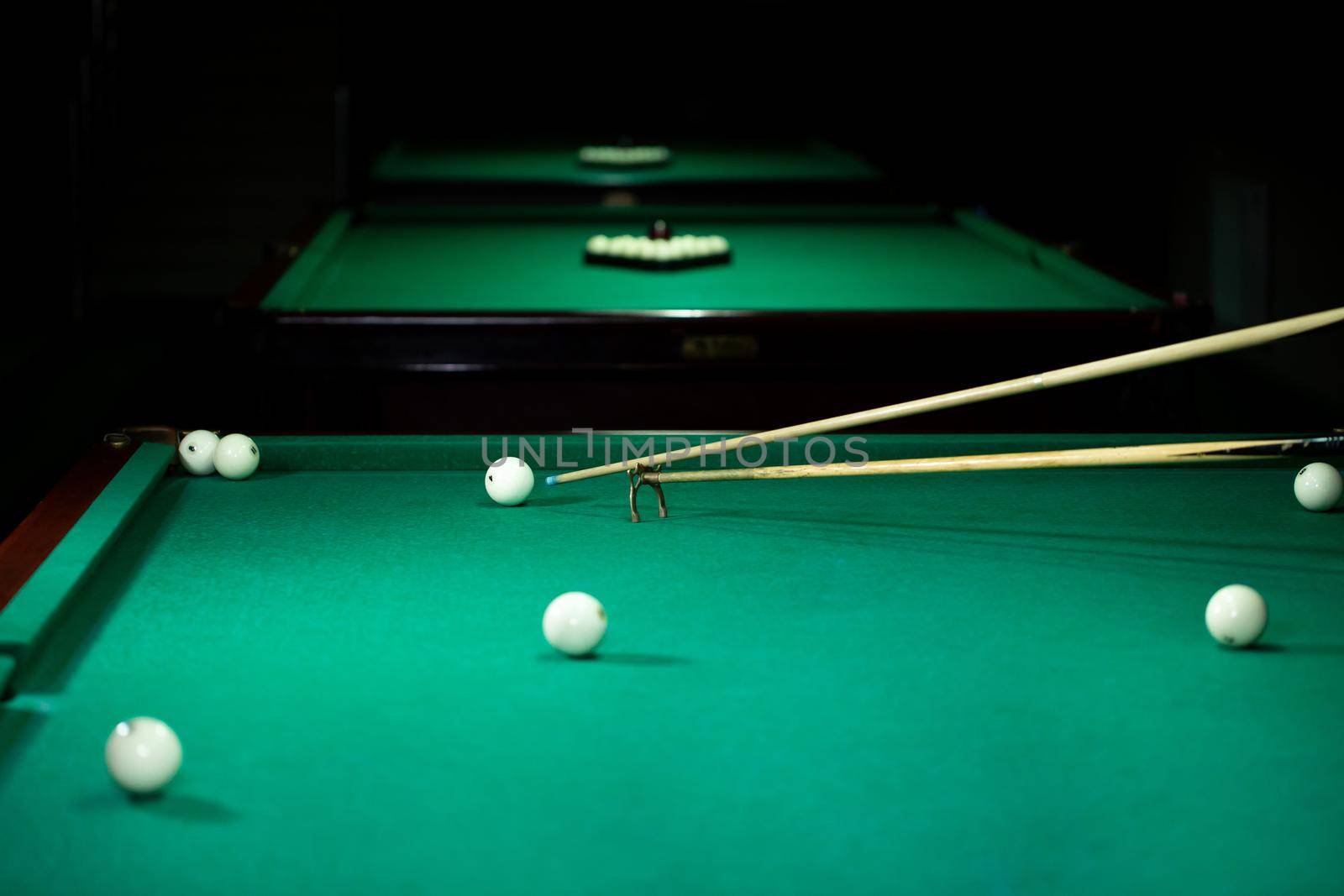 Billiard balls in a green pool table. by StudioPeace