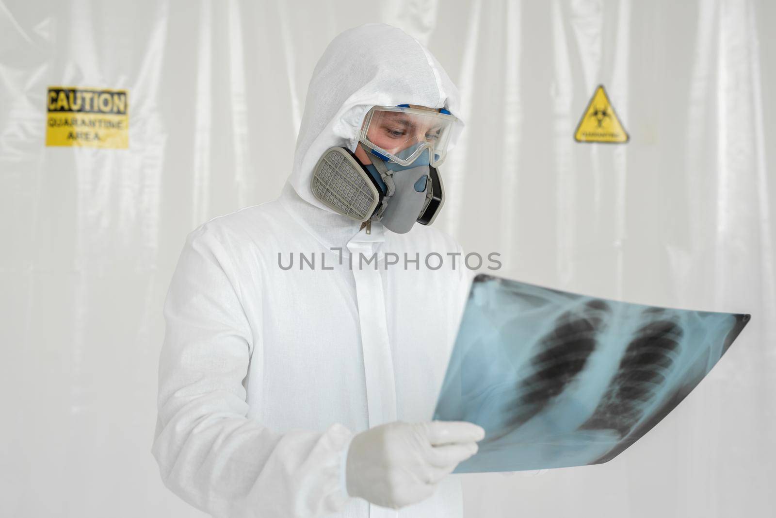 Doctor man with X-ray of lungs, fluorography, roentgen isolated on white background. Coronavirus concept.