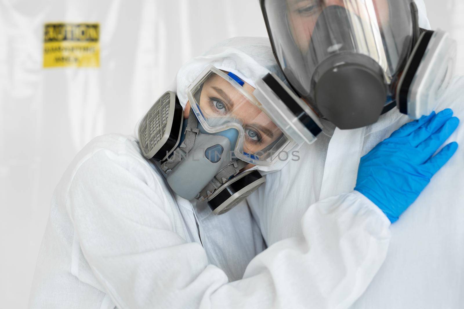 Coronavirus epidemic outbreak. Portrait of doctors in clean suits with protective respirator.