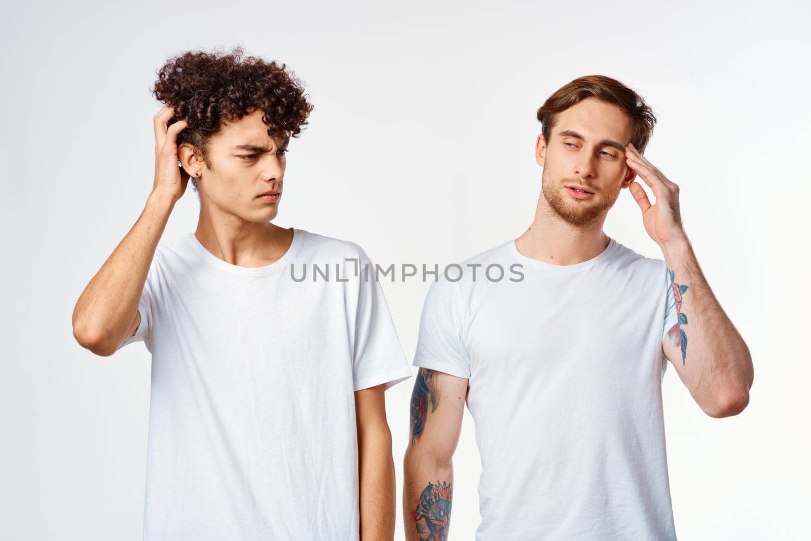 two friends in white t-shirts together lifestyle emotions fun by SHOTPRIME