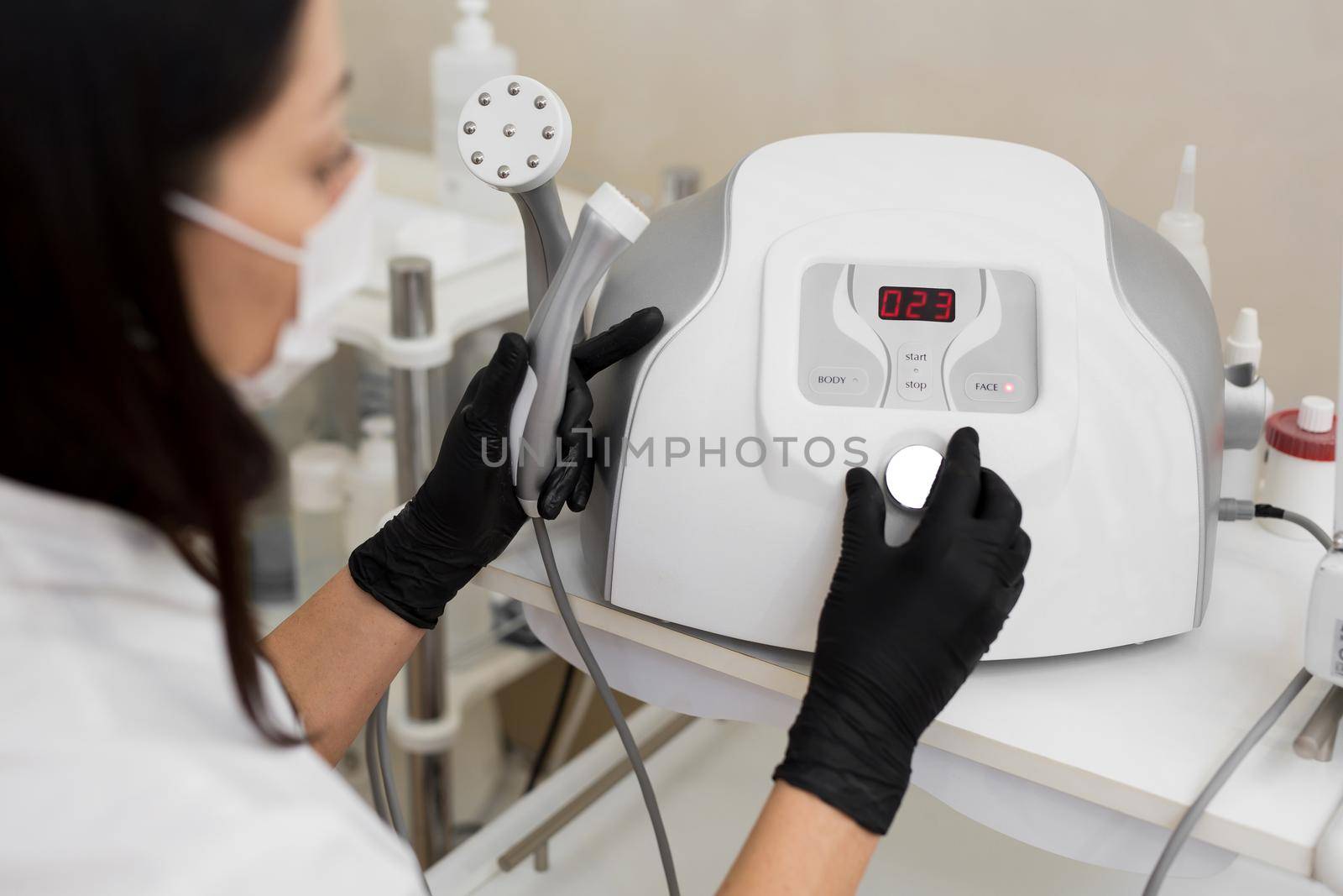 Close-up of a cosmetologist includes a mesotherapy medical device. Close-up of medical equipment in a cosmetology clinic. Skin care