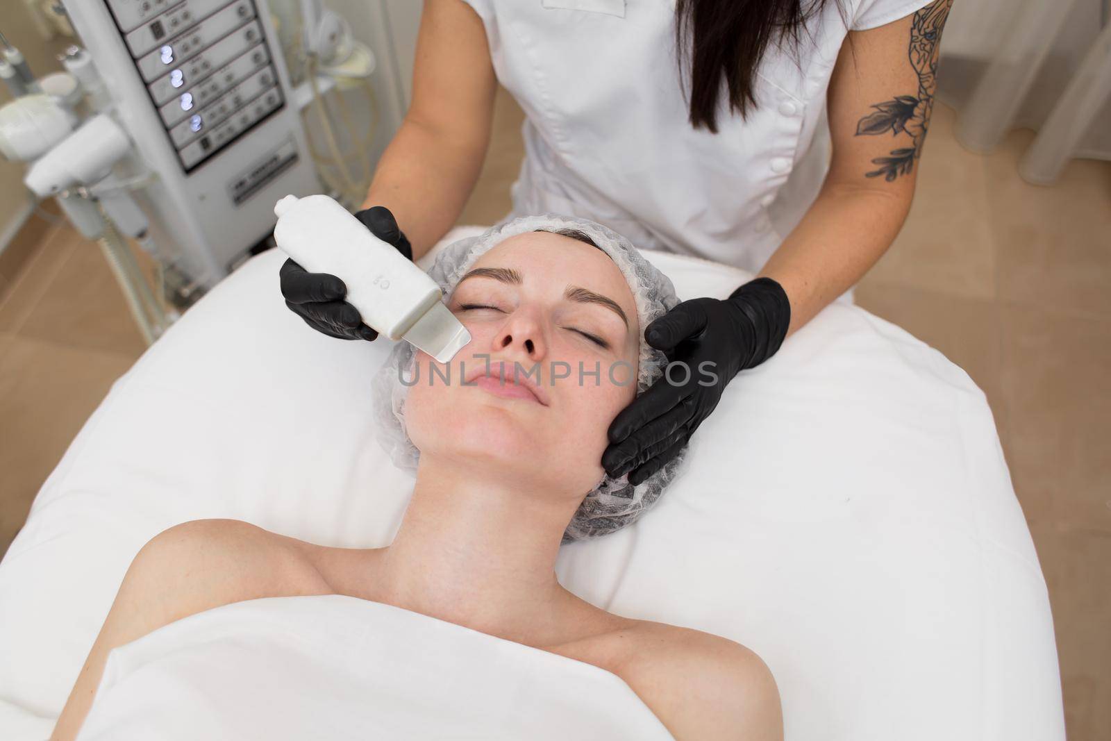 Skin Care. Close-up Of Beautiful Woman Receiving Ultrasound Cavitation Facial Peeling. Ultrasonic Skin Cleansing Procedure. Beauty Treatment. Cosmetology. Beauty Spa Salon by StudioPeace