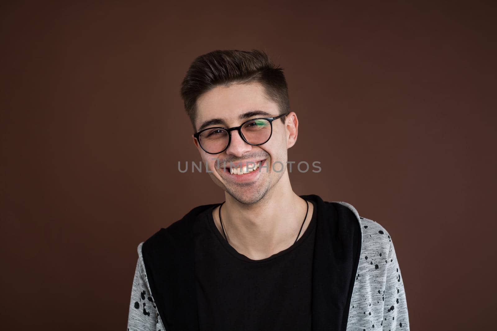 Portrait of laughing young man. Happy guy smiling by StudioPeace