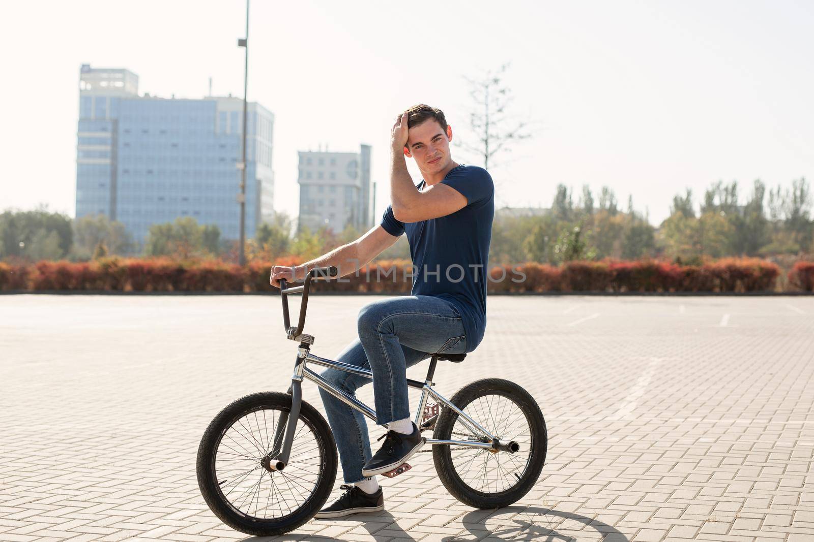 Young urban bmx racer in the city. by StudioPeace