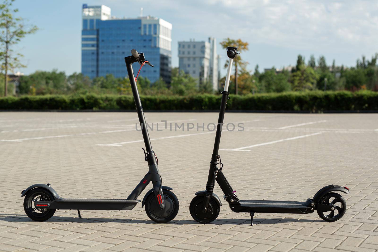 Modern electric scooters parking on the street. by StudioPeace