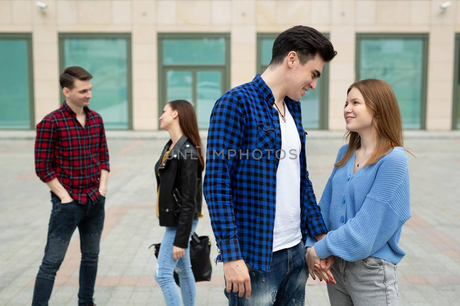 Friends walk around the city and communicate