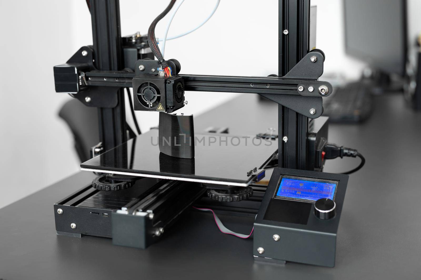 Electronic three dimensional plastic 3D printer during work in laboratory. by StudioPeace