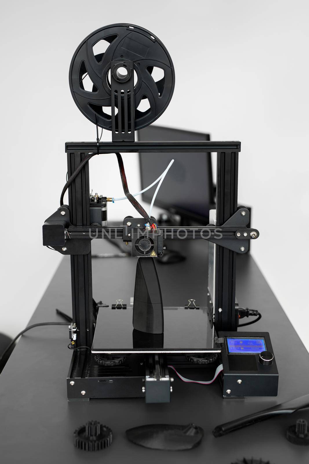 Electronic three dimensional plastic 3D printer during work in laboratory. by StudioPeace