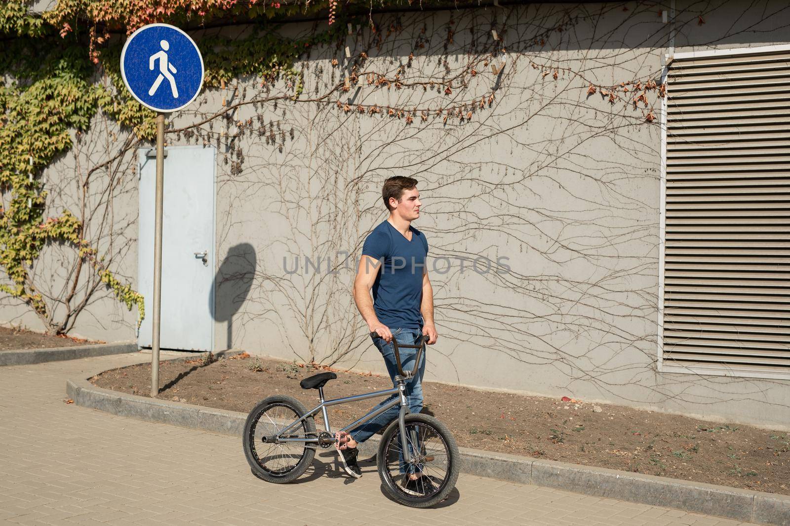 Young urban bmx racer in the city