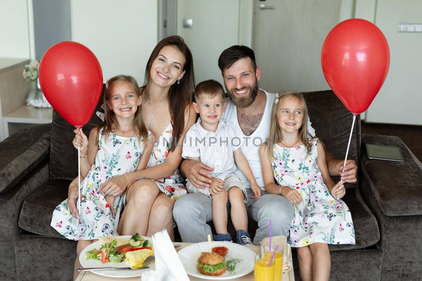 Family breakfast in the hotel. Portrait of a young family with children. by StudioPeace