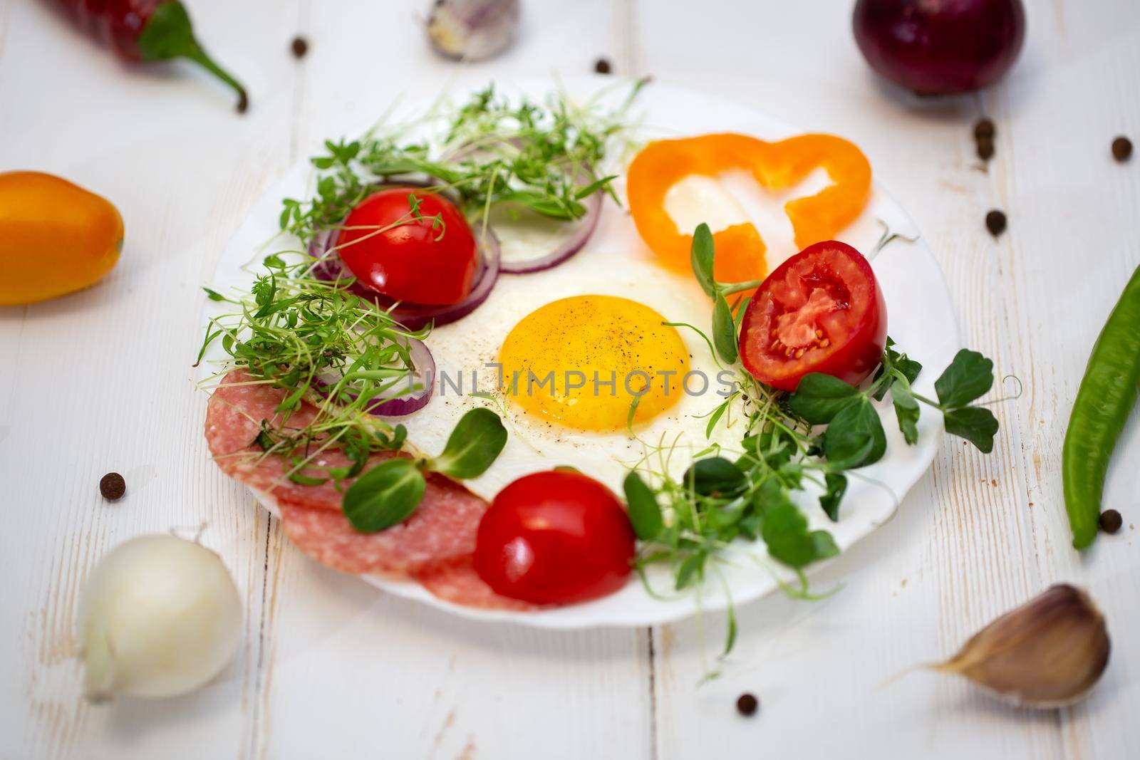 Sandwich with scrambled eggs, tomatoes, sprouts of arugula and radishes, micro-greens Healthy food