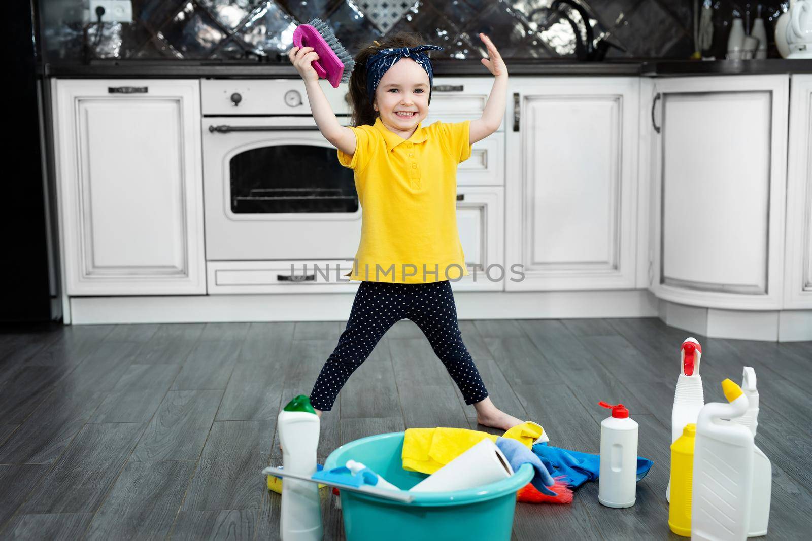 Little girl helps with the cleaning in the house by StudioPeace