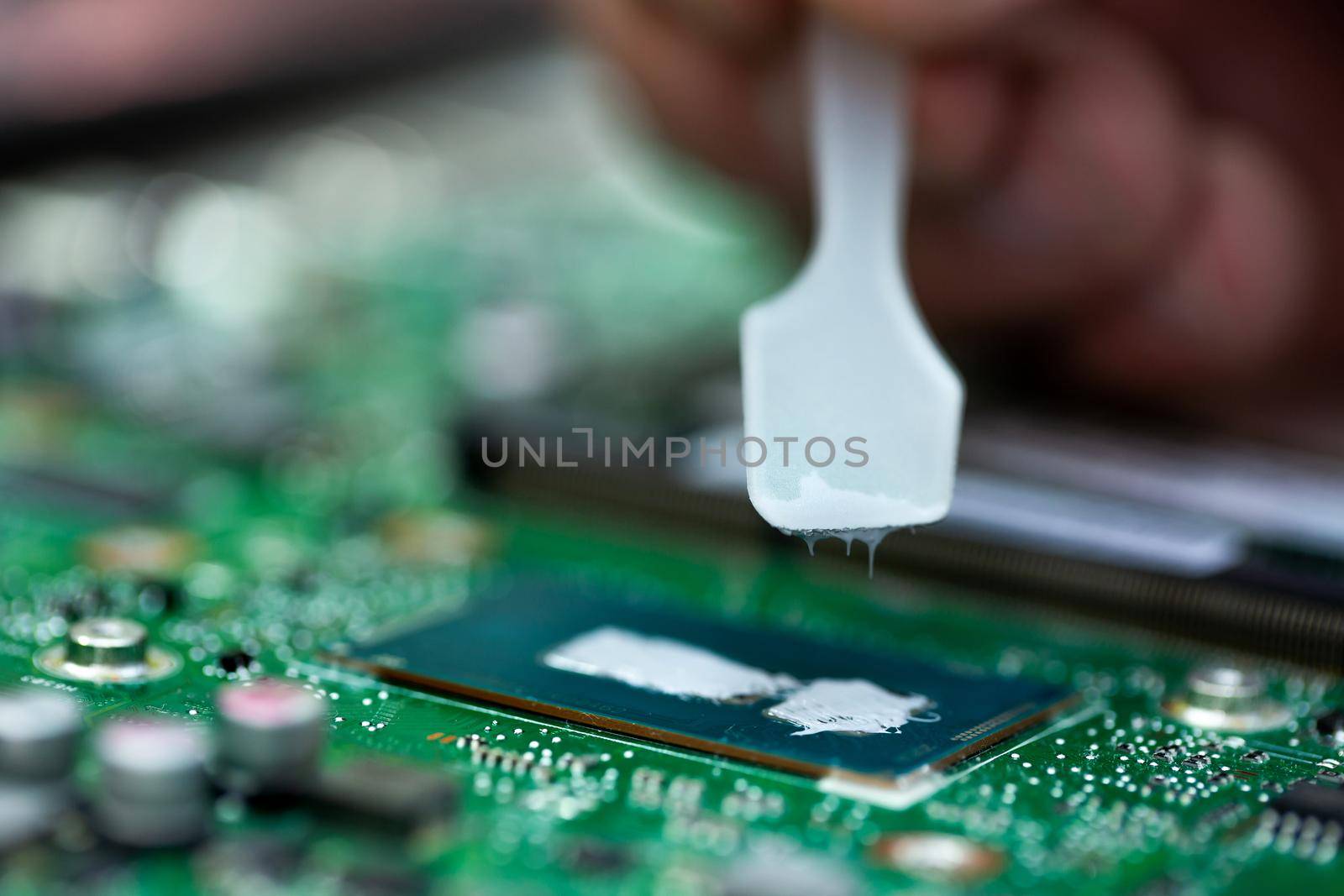 Thermal paste is applied to the laptop processor