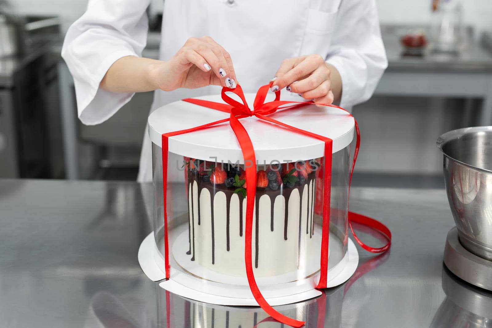 Pastry chef packs the cake in a fancy box by StudioPeace
